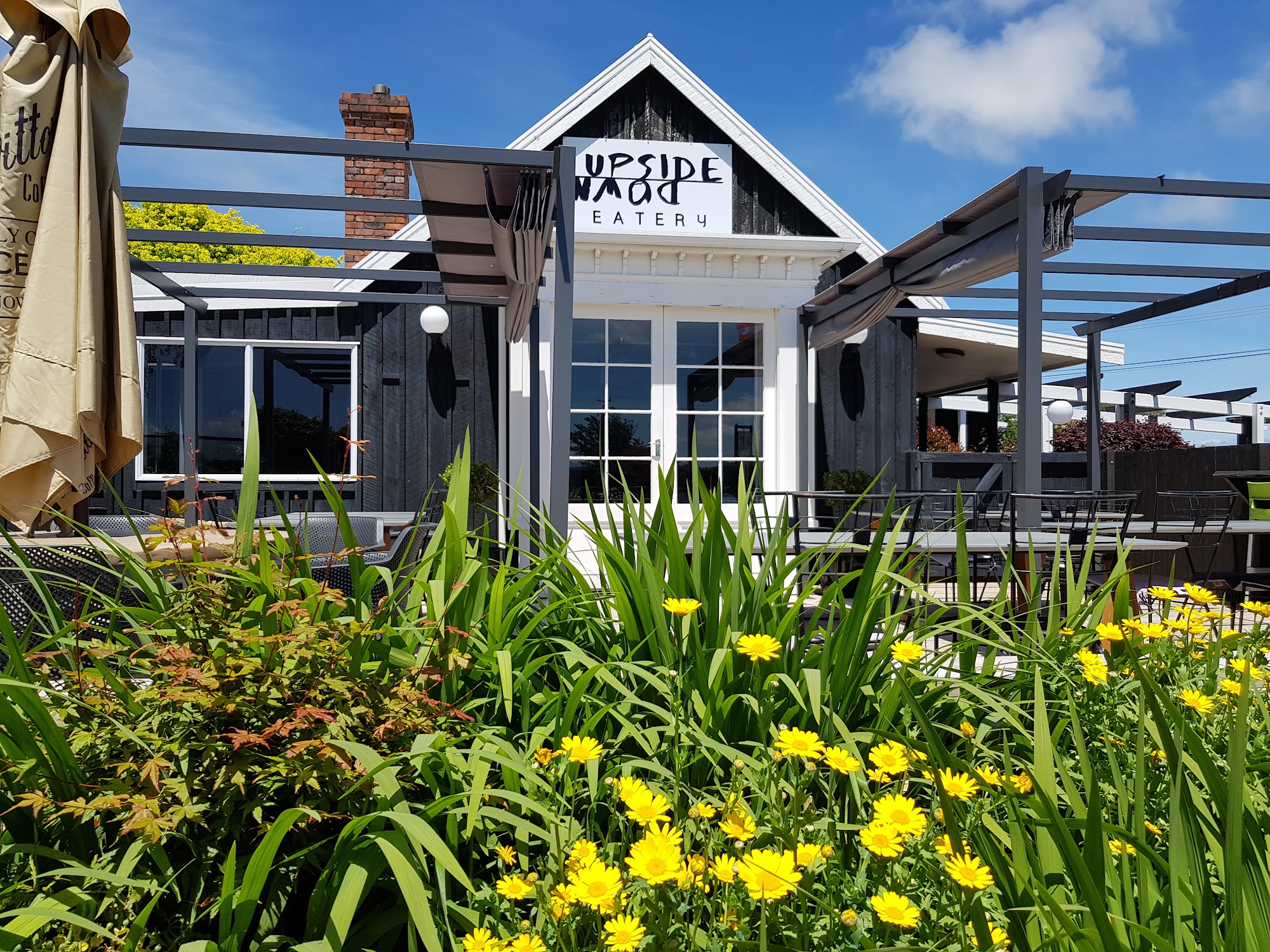 Upside Down Eatery exterior with garden